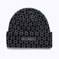 A black beanie with a repeating star pattern and a retro Method logo.