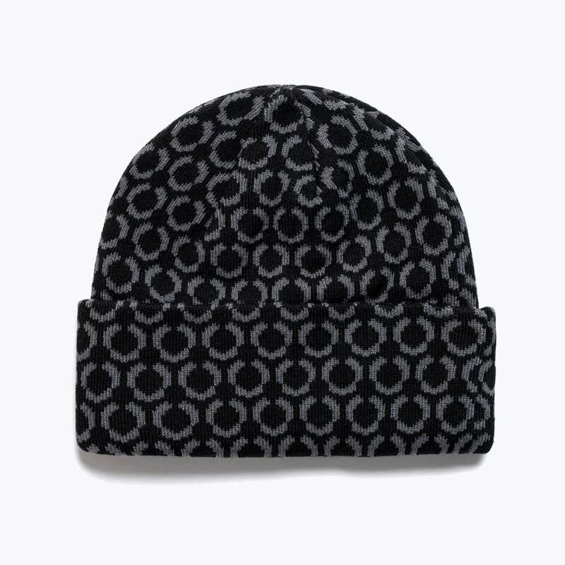 A black beanie with a repeating star pattern and a retro Method logo.