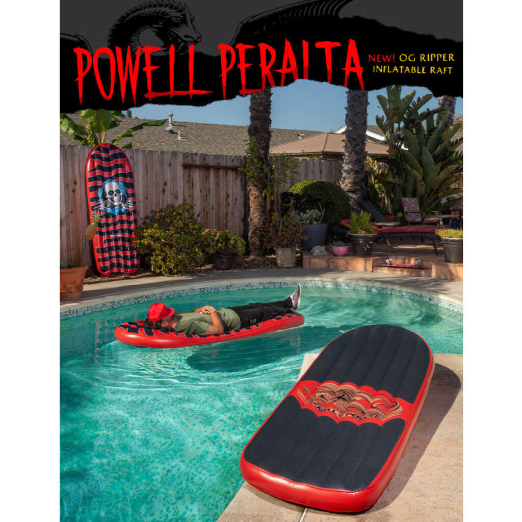 A red inflatable Powell Peralta Ripper Raft, shaped like a skateboard, floating in a pool.