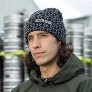 A person wearing a black Method Star Beanie, looking towards the camera.