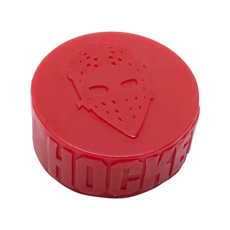 Hockey Skateboard Puck Wax - A large block of green wax shaped like a hockey puck.